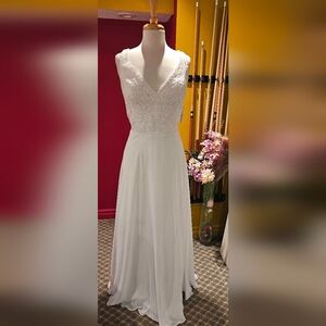 Armless lace and beaded bodice bridal dress with pockets